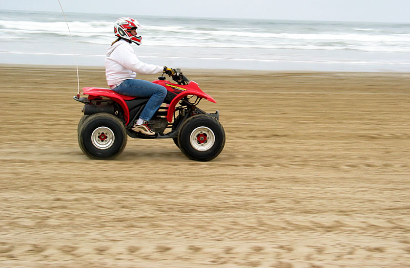 Some chick on a quad, playing with slightly longer shutter speeds