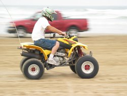 Some guy on a quad, playing with slightly longer shutter speeds