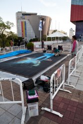 Dudes creating 3D chalk art in front of the Osaka Aquarium