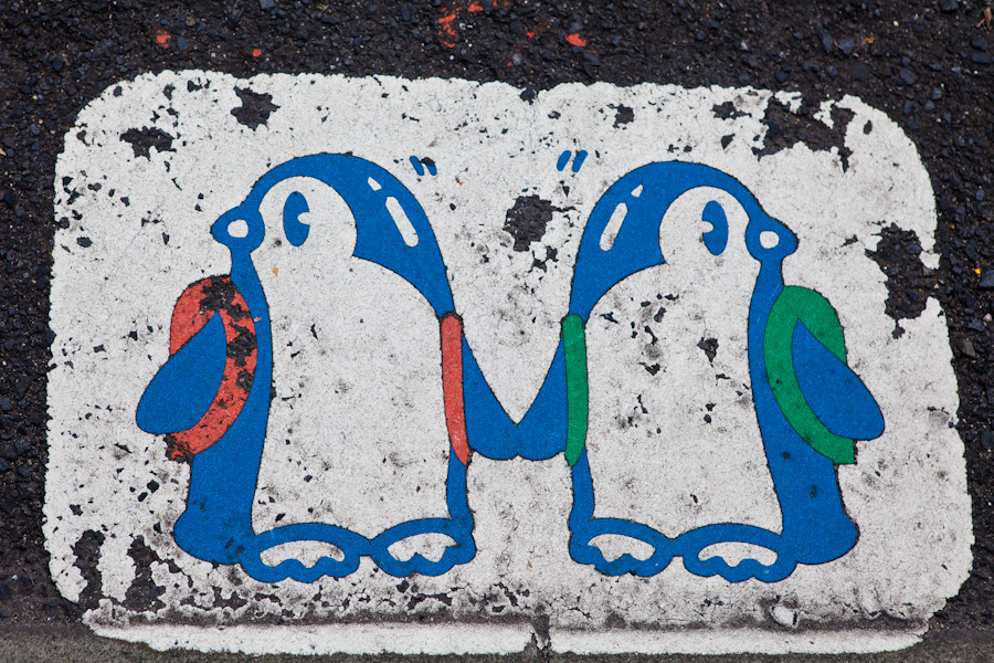 The penguins demand you hold flippers and look both ways before crossing the street
