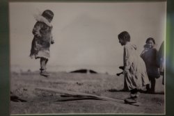 This photo of Inuit children playing on a makeshift seesaw really struck me.