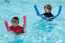 Will and Andrew ride pool noodles