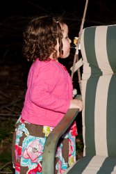 Violet sneakily eating a marshmallow off a stick 3