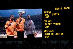 Men's 100m medal ceremony: Usain Bolt with gold and USA's Justin Gatlin with Bronze