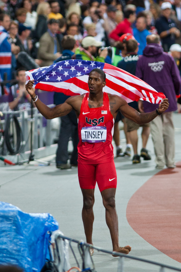 American Michael Tinsley celebrates his silver medal in the Men's 400m Hurdles 1