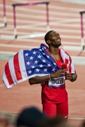 American Michael Tinsley celebrates his silver medal in the Men's 400m Hurdles 2