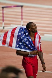 American Michael Tinsley celebrates his silver medal in the Men's 400m Hurdles 3