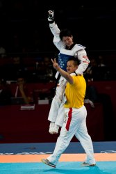 China's Jingyu Wu celebrates gold with her coach (1)