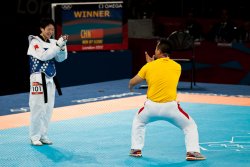 China's Jingyu Wu celebrates gold with her coach (2)